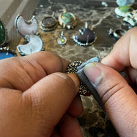 jewelry polishing cloth being used to polish a textured ring