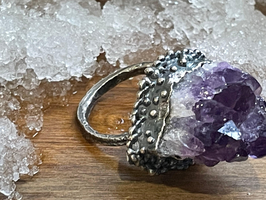 Wolf Cluster Ring on wood top side view. (Size US 10). Wolf Cluster Ring on ice top side view. Textured ring Bohemian ring Statement ring Bold ring Large ring Sterling silver ring Unique ring Goddess ring Cosmic ring   Gemstone ring  Amethyst Ring Amethyst Cluster Ring Purple Stone Ring