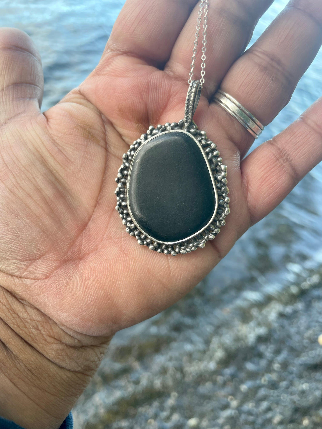 Black Beach Stone Necklace in my hand. Black Beach Stone Necklace by the sea. Bohemian necklace Bold necklace Beautiful necklace Sterling silver necklace Goddess necklace Sexy necklace Textured necklace Statement necklace Unique necklace  Cosmic necklace Black Necklace