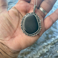 Black Beach Stone Necklace in my hand. Black Beach Stone Necklace by the sea. Bohemian necklace Bold necklace Beautiful necklace Sterling silver necklace Goddess necklace Sexy necklace Textured necklace Statement necklace Unique necklace  Cosmic necklace Black Necklace
