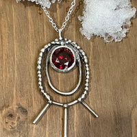 Shakti Large Oval Necklace in red. Shakti Large Oval Necklace lying on snow. Bohemian necklace Bold necklace Beautiful necklace Sterling silver necklace Goddess necklace Sexy necklace Textured necklace Statement necklace Unique necklace Cosmic necklace Cubic Zirconia Necklace Bling Necklace